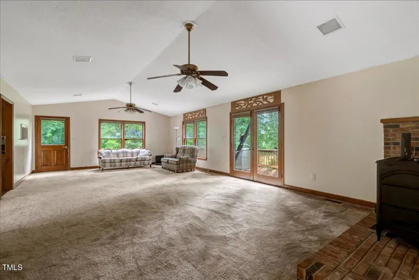 a view of livingroom with furniture and window