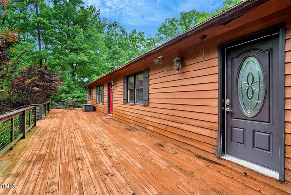 a view of a patio with wooden floor