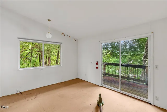 a view of a room with a large window