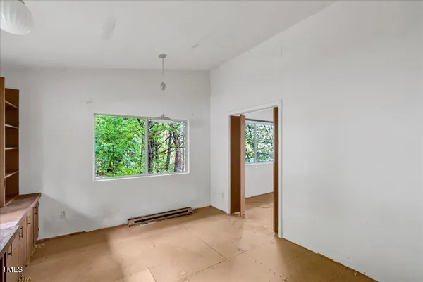 a view of an empty room with a window