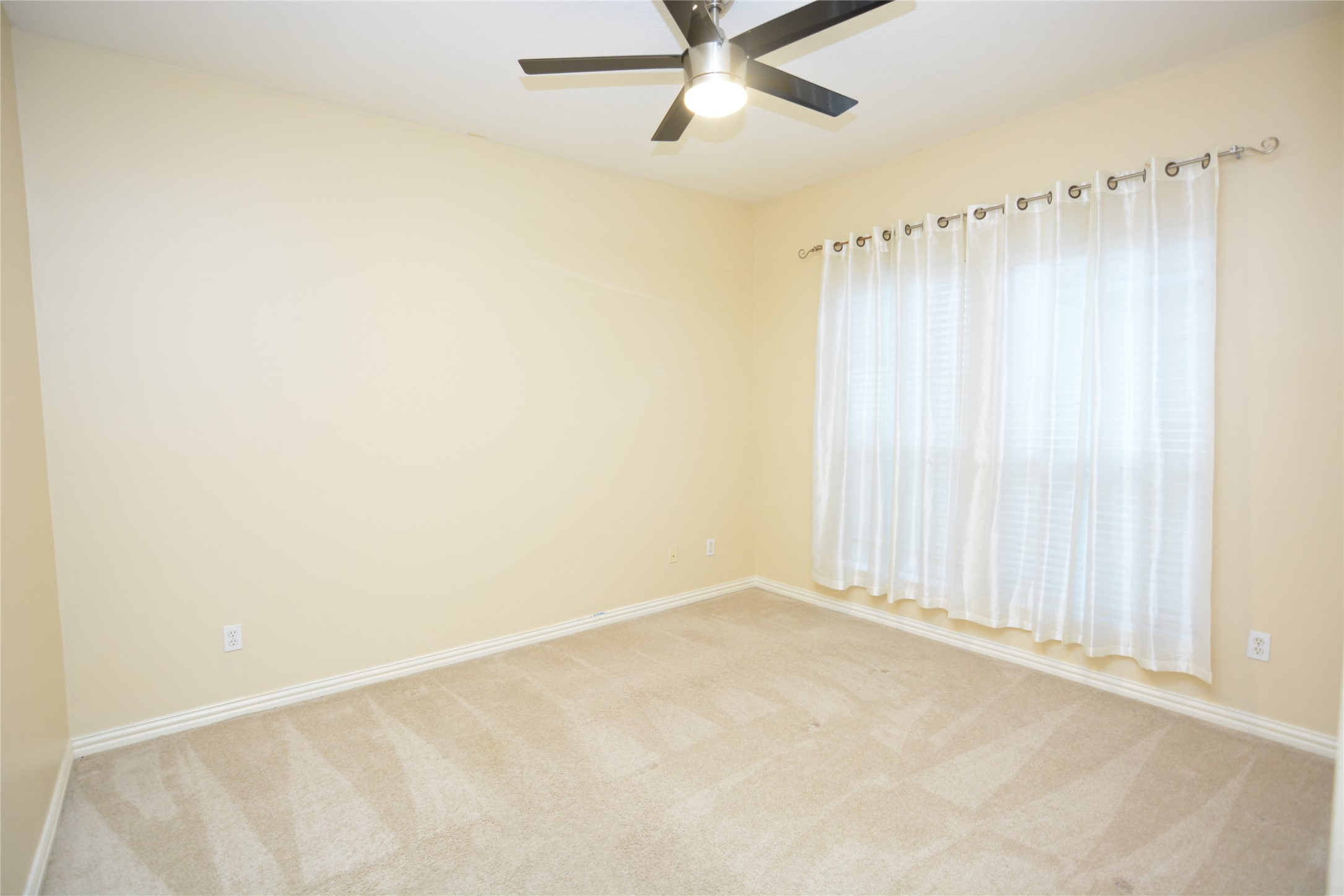 6119 Windwater Pointe Houston, TX 77036 - Photo 13 of 23 a view of a room with a window