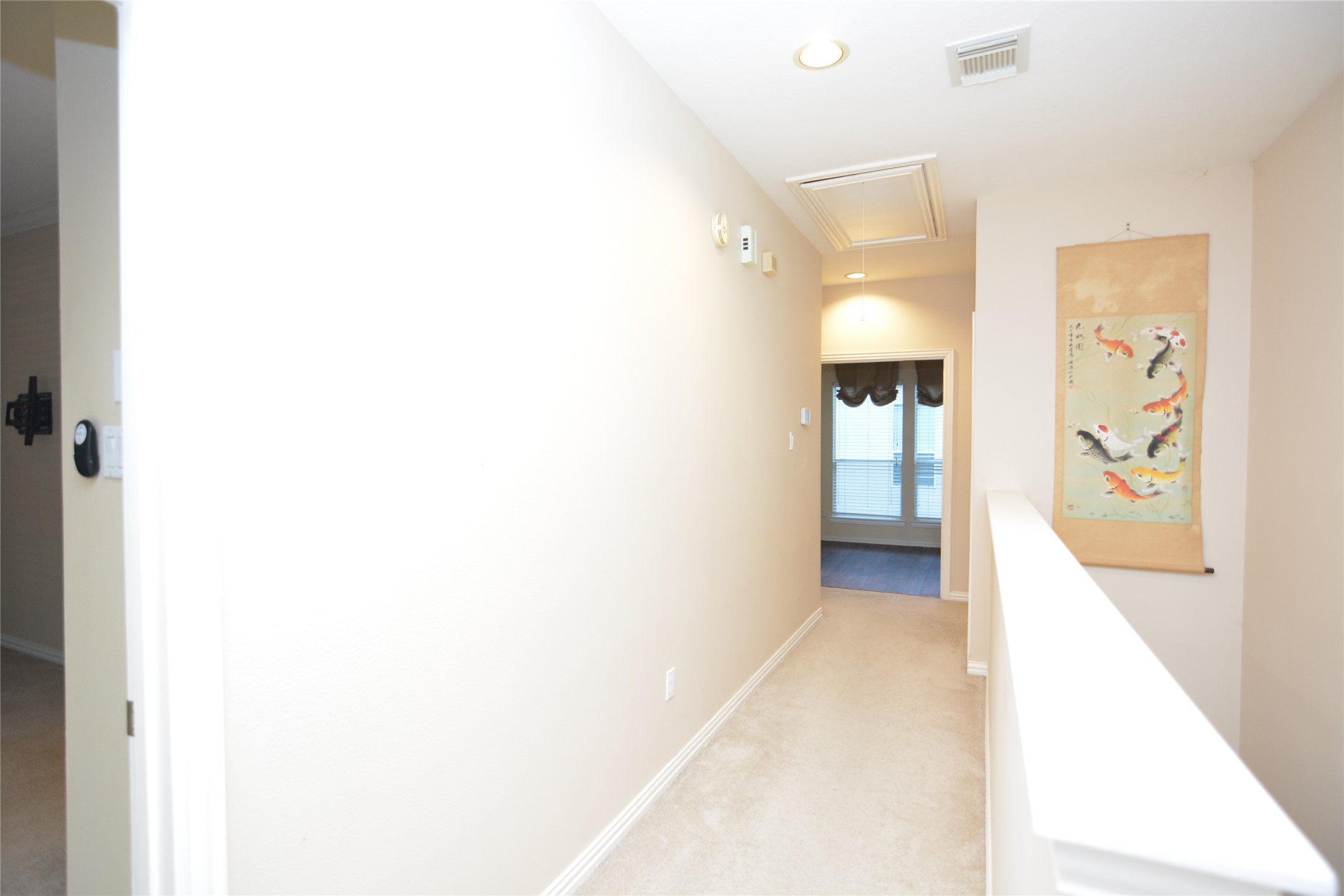 6119 Windwater Pointe Houston, TX 77036 - Photo 15 of 23 a view of a hallway with wooden floor