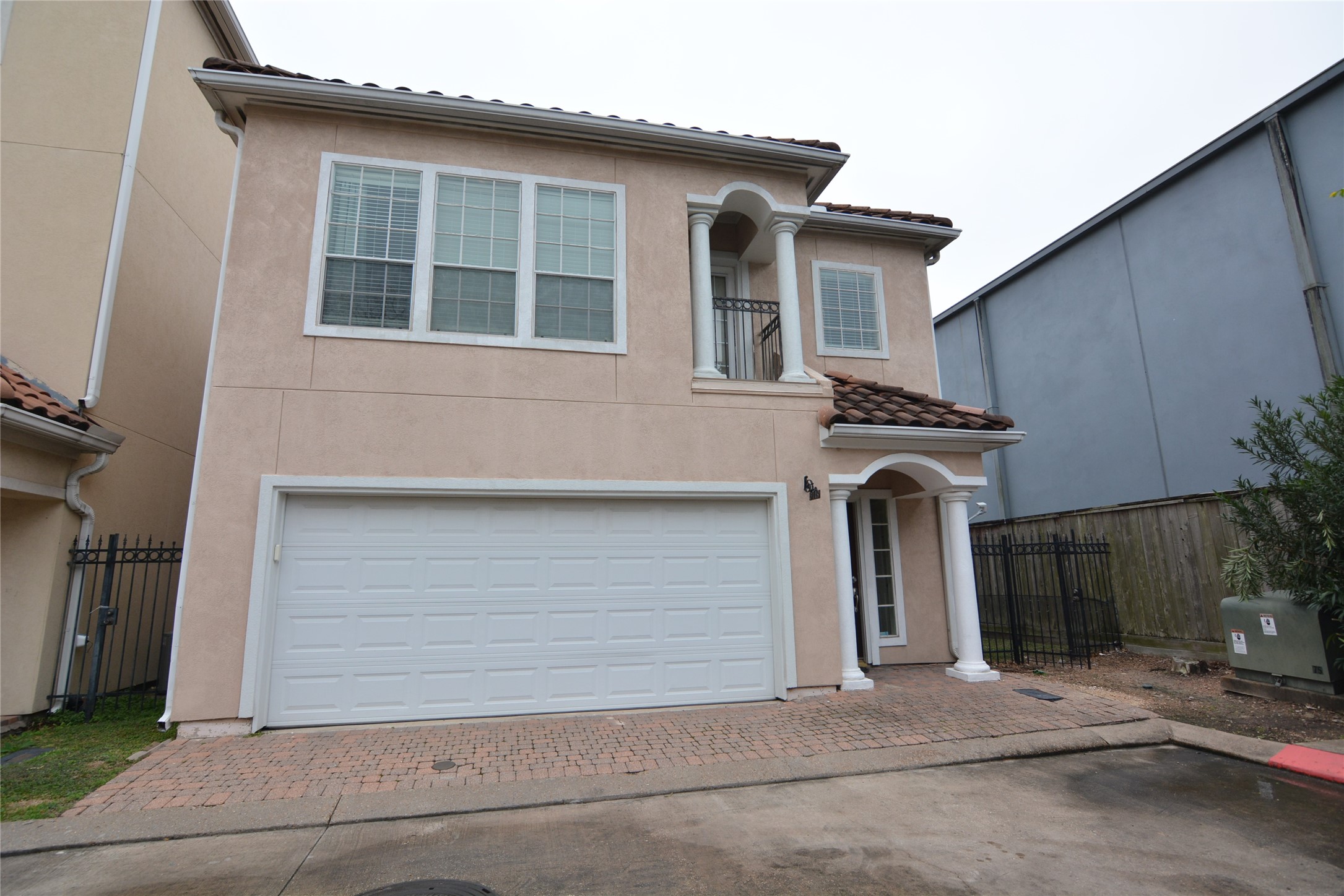 6119 Windwater Pointe Houston, TX 77036 - Photo 2 of 23 a front view of a house with garage