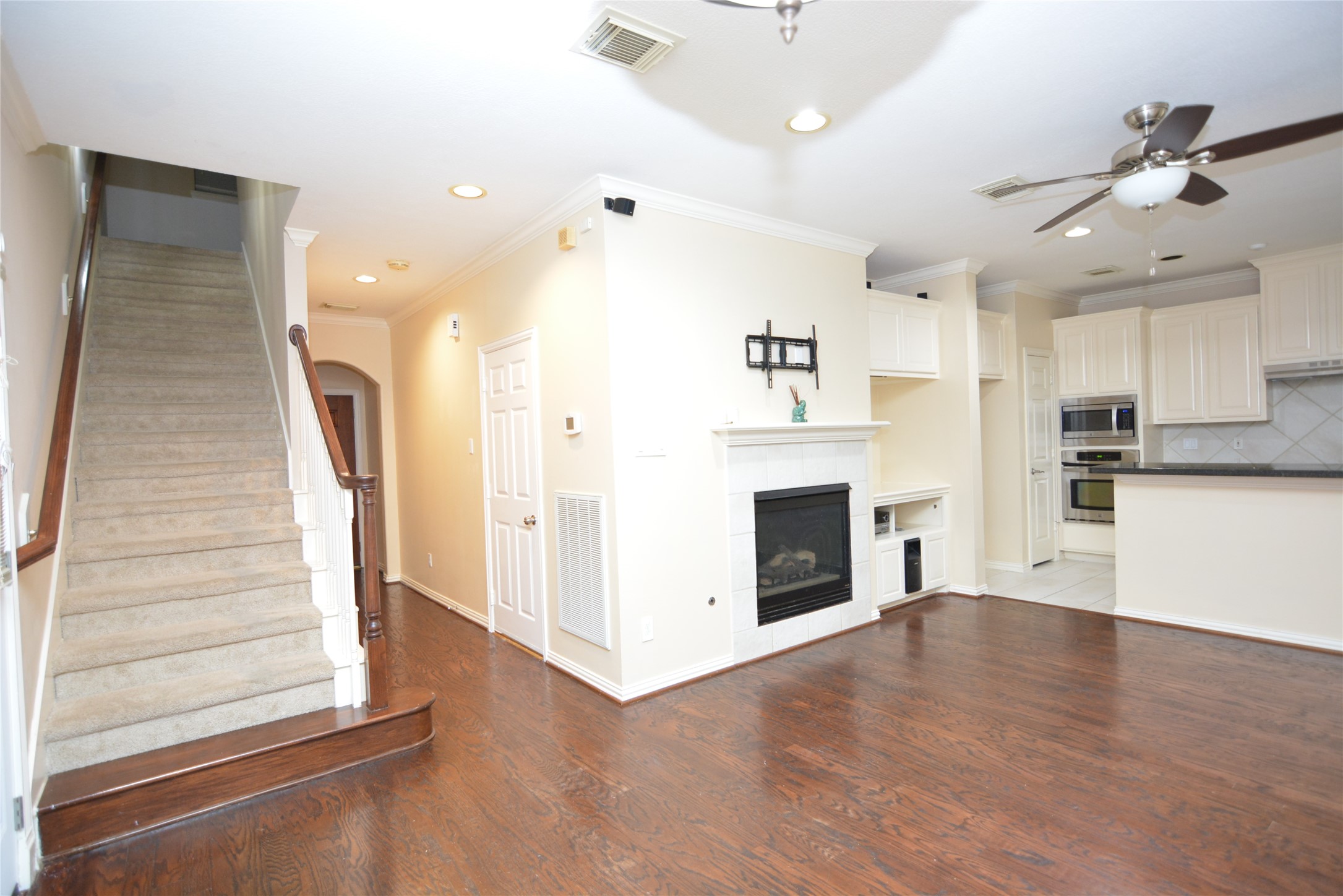 6119 Windwater Pointe Houston, TX 77036 - Photo 4 of 23 a view of a kitchen with furniture and a fireplace