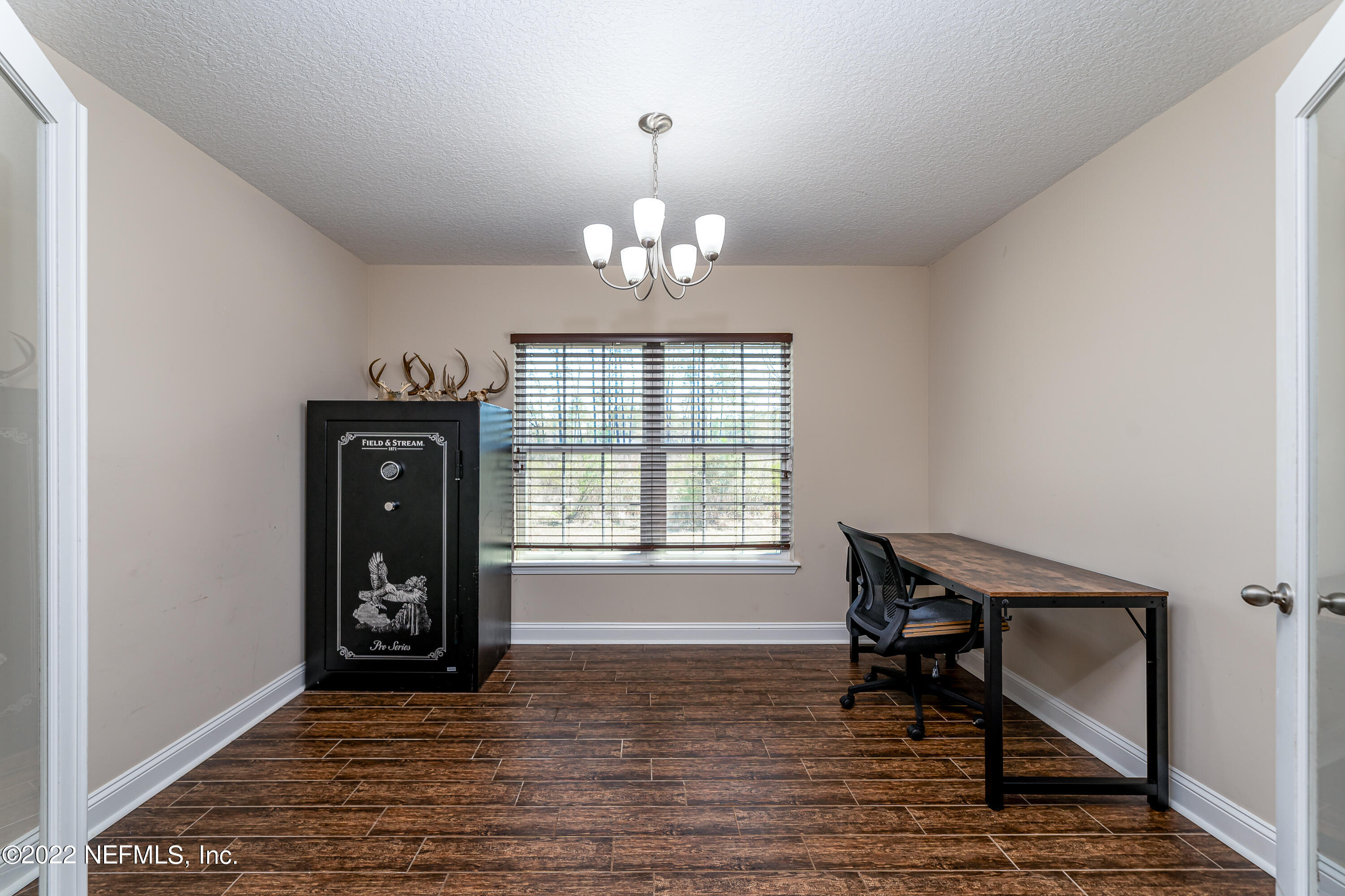 9143 McClelland Road Jacksonville, FL 32234 - Photo 15 of 37 a view of a livingroom with furniture window and wooden floor