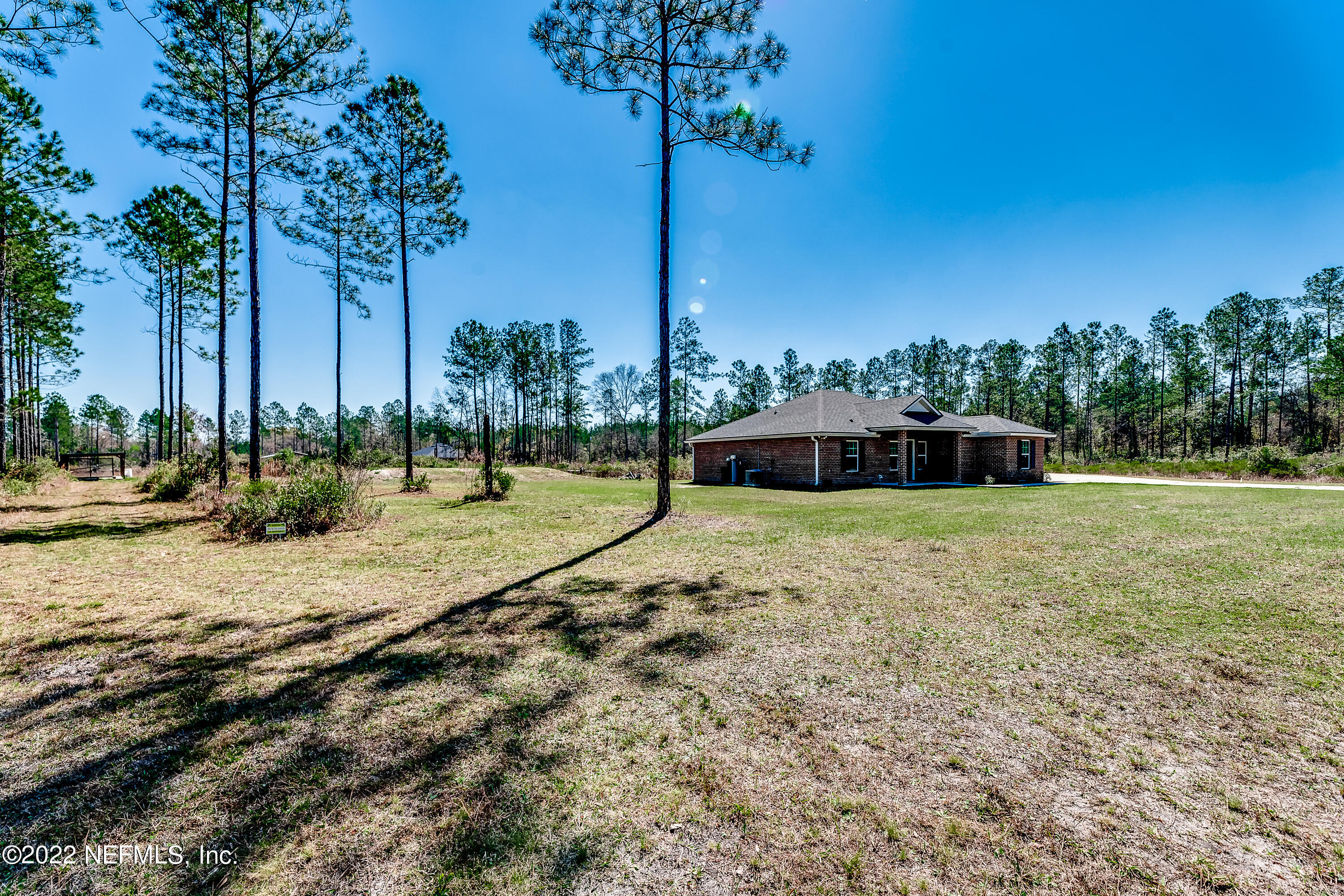 9143 McClelland Road Jacksonville, FL 32234 - Photo 3 of 37 a view of a house with a yard