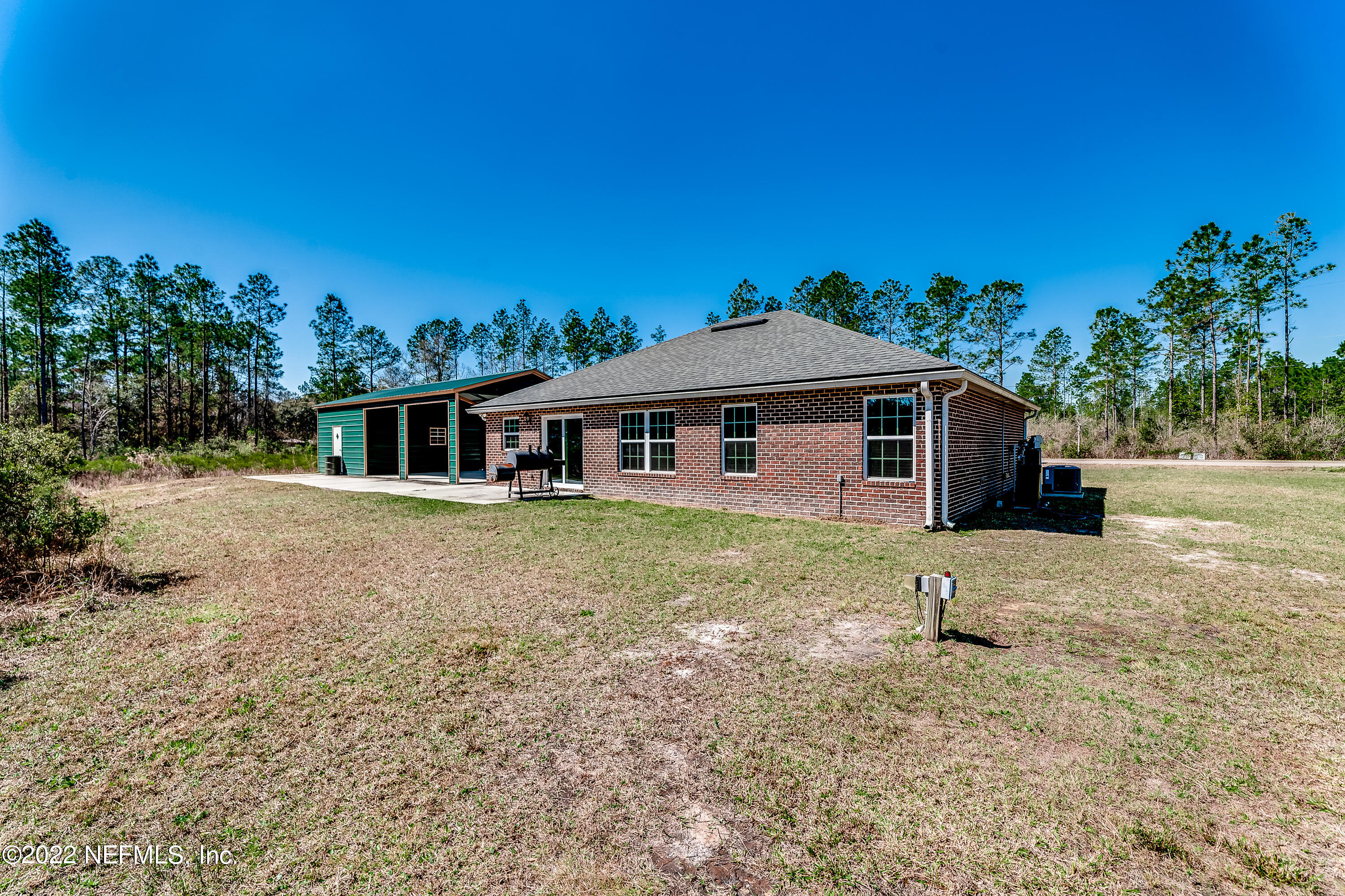 9143 McClelland Road Jacksonville, FL 32234 - Photo 33 of 37 a front view of a house with a yard