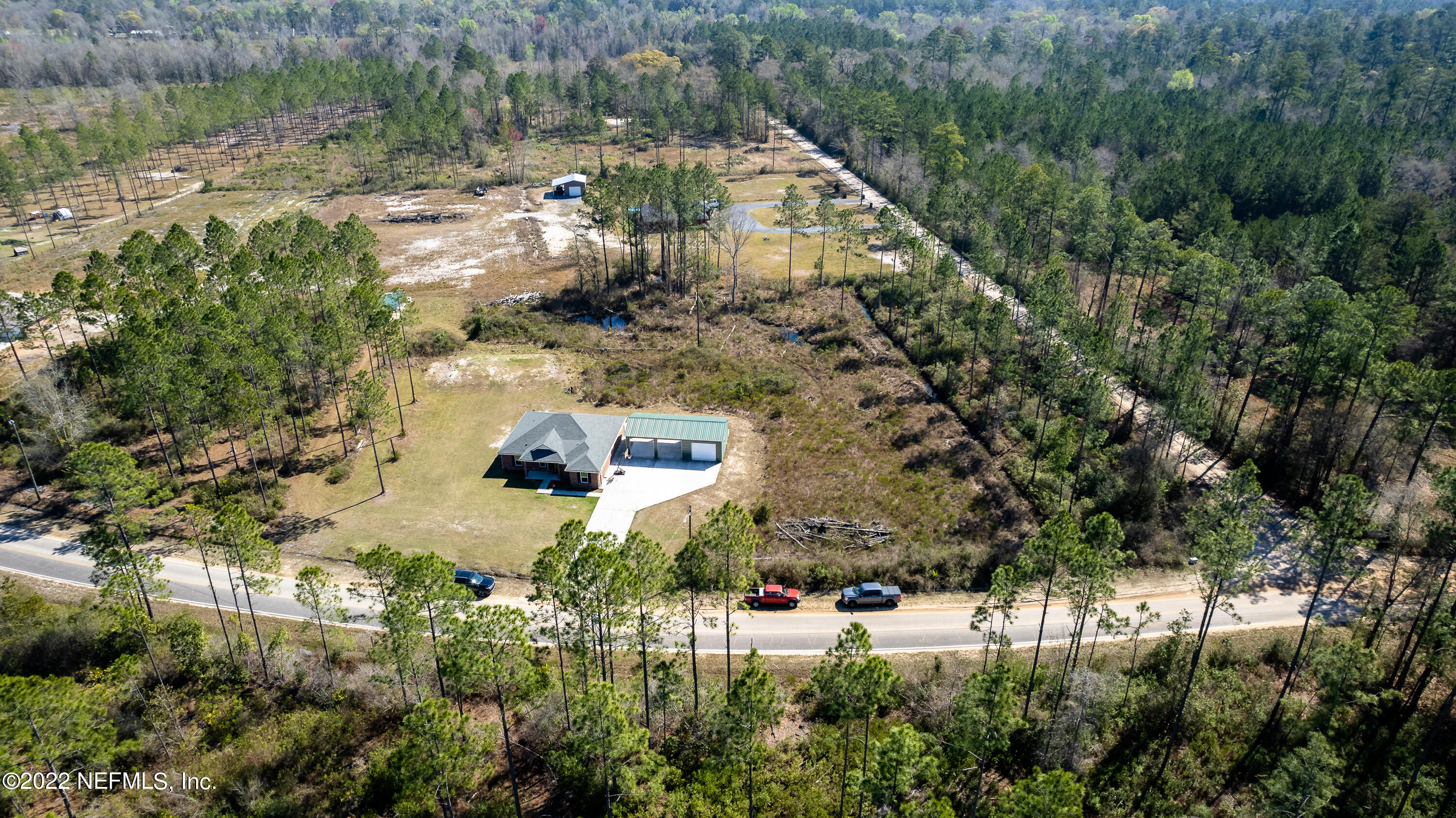 9143 McClelland Road Jacksonville, FL 32234 - Photo 37 of 37 a aerial view of a house with a yard and lake view