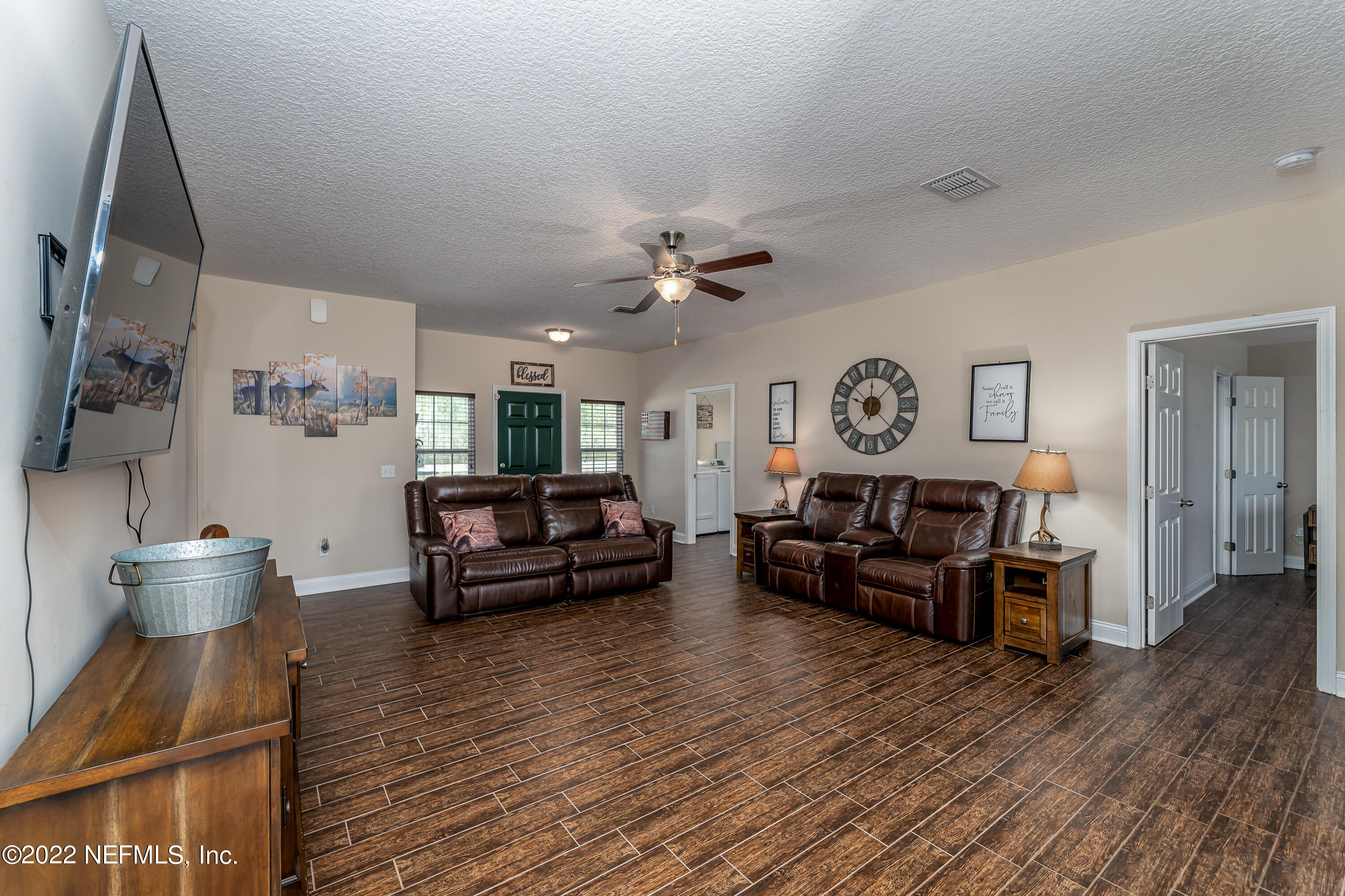 9143 McClelland Road Jacksonville, FL 32234 - Photo 7 of 37 a living room with furniture and wooden floor