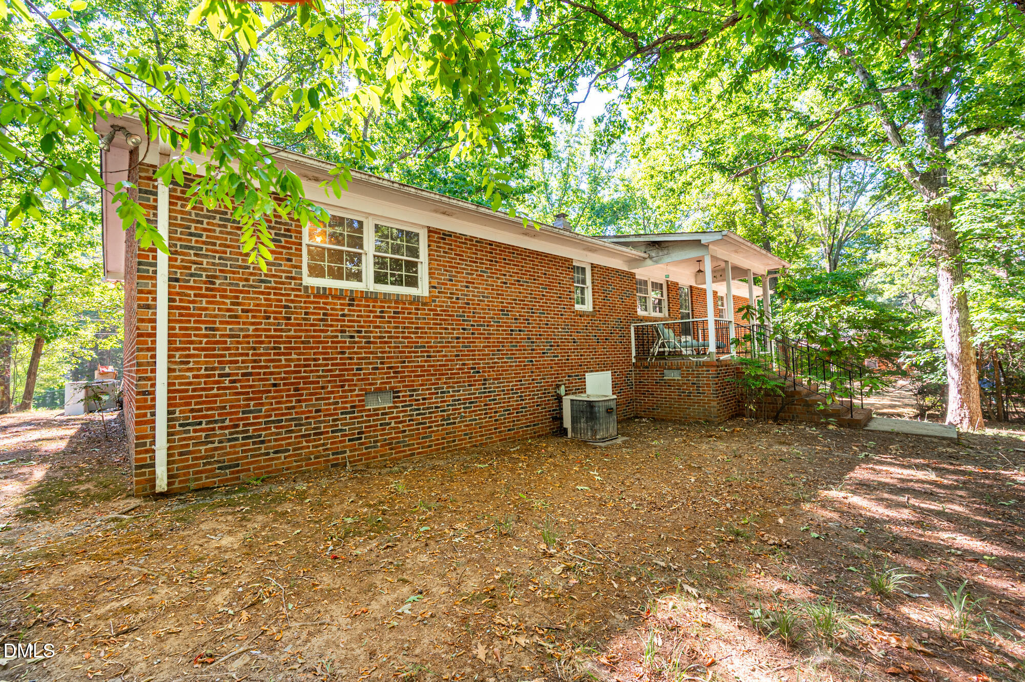 4411 Rhew Drive Durham, NC 27704 - Photo 32 of 34 a backyard of a house with seating area