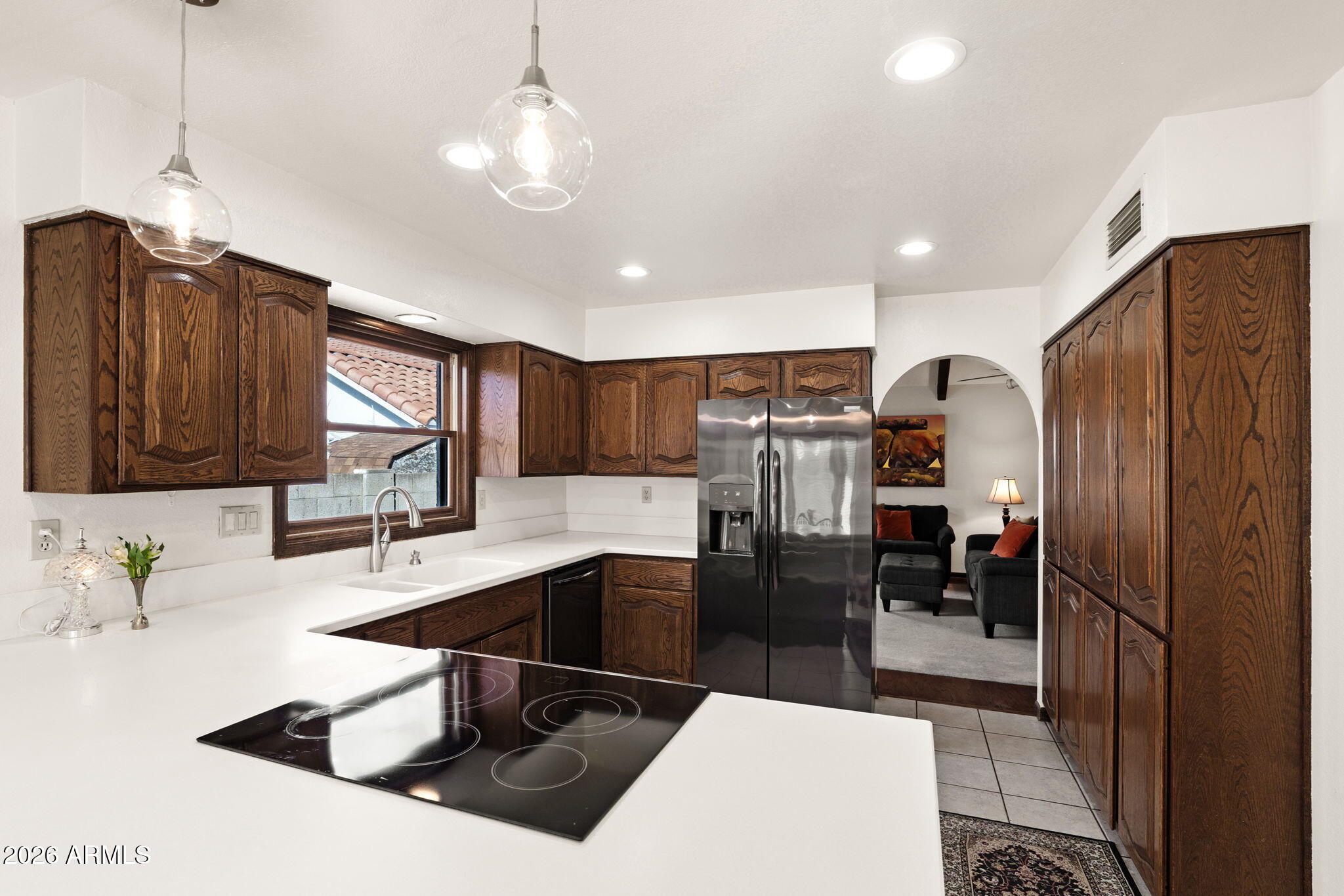 2029 East Lockwood Street Mesa, AZ 85213 - Photo 13 of 23 a kitchen with stainless steel appliances granite countertop a sink a stove and a refrigerator
