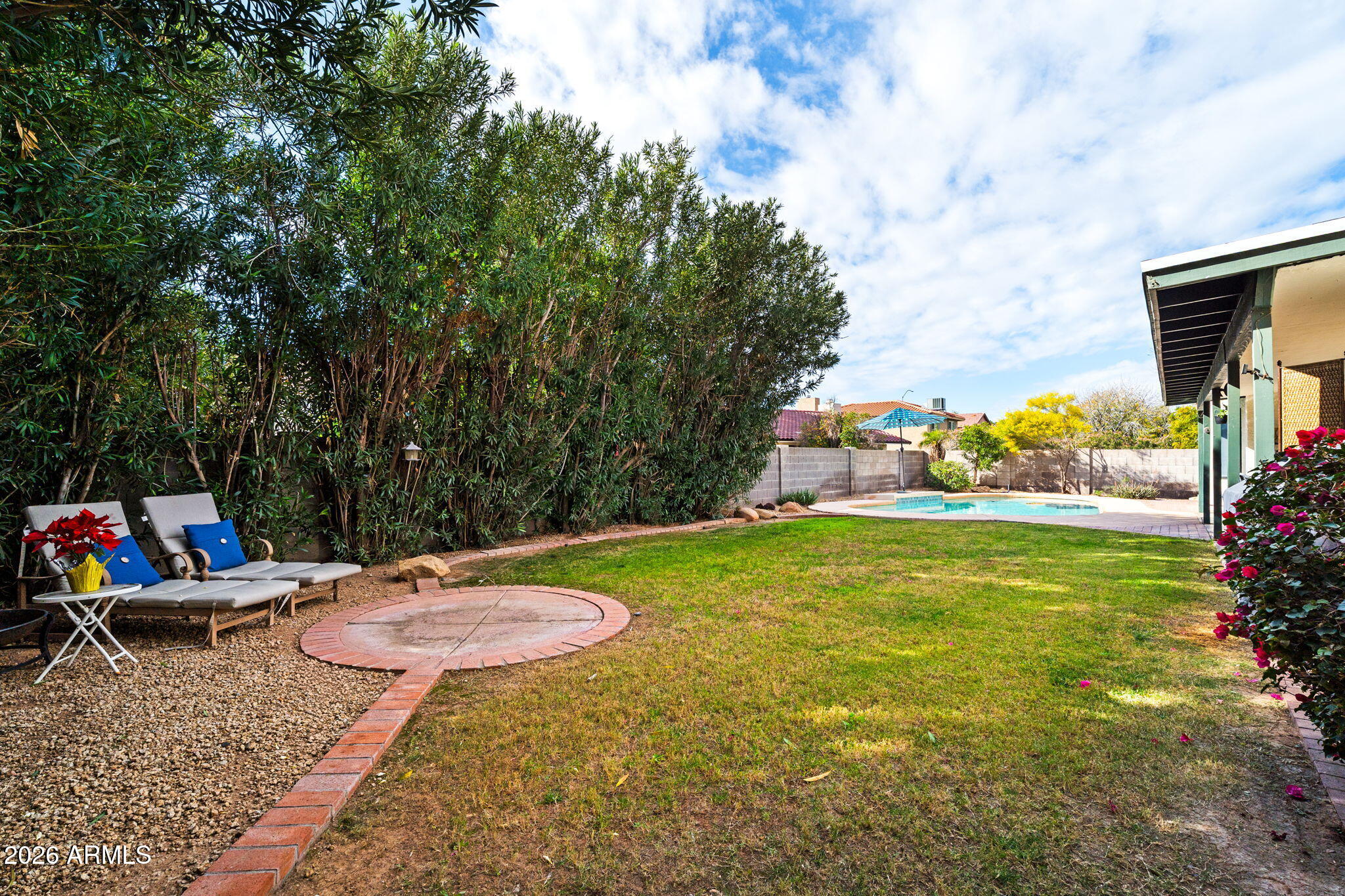 2029 East Lockwood Street Mesa, AZ 85213 - Photo 18 of 23 a backyard of a house with table and chairs