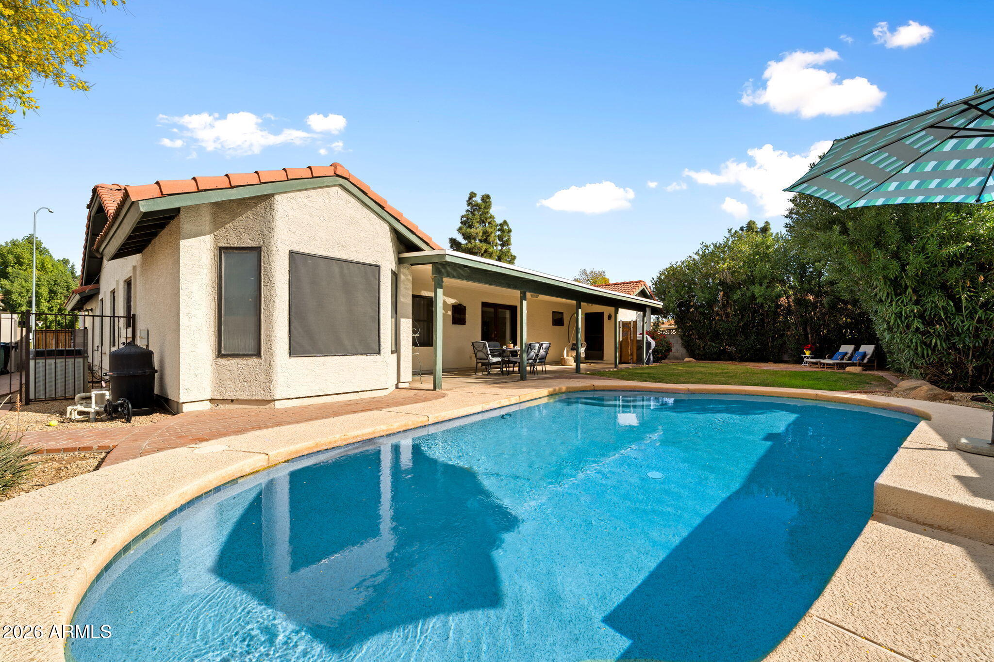 2029 East Lockwood Street Mesa, AZ 85213 - Photo 20 of 23 a front view of house with yard and swimming pool