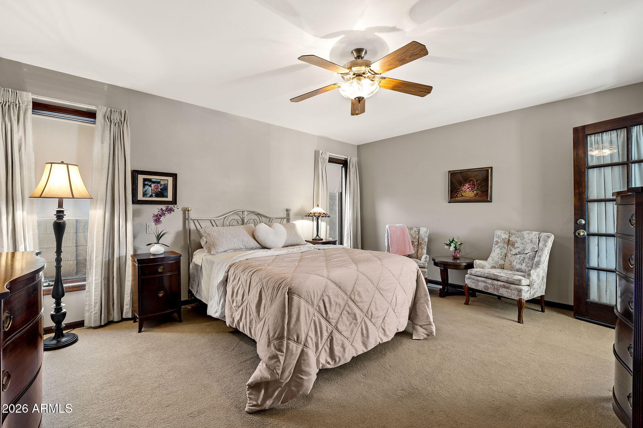 2029 East Lockwood Street Mesa, AZ 85213 - Photo 8 of 23 a spacious bedroom with a bed and a chandelier