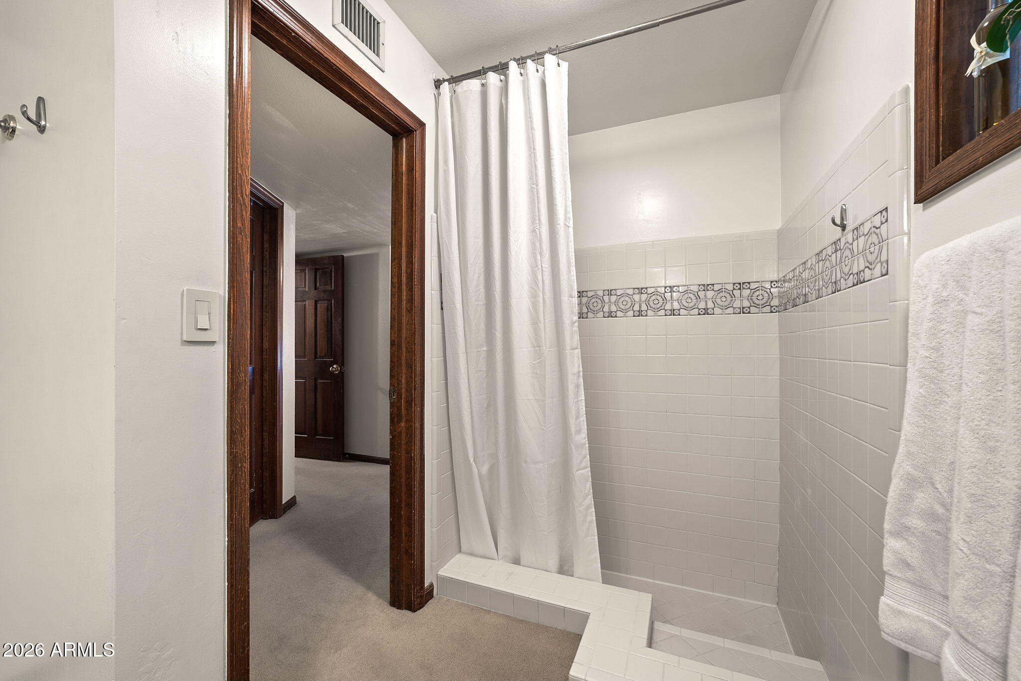 2029 East Lockwood Street Mesa, AZ 85213 - Photo 9 of 23 a bathroom with a glass shower door