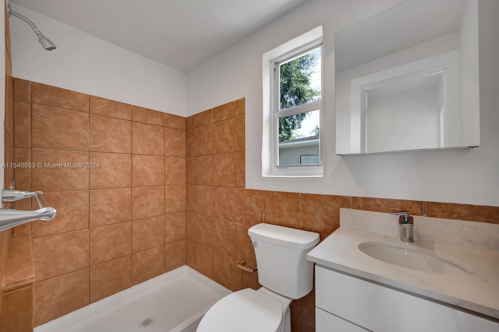 Palm Grove Miami, FL 33138 - Photo 12 of 13 a bathroom with a sink and a toilet