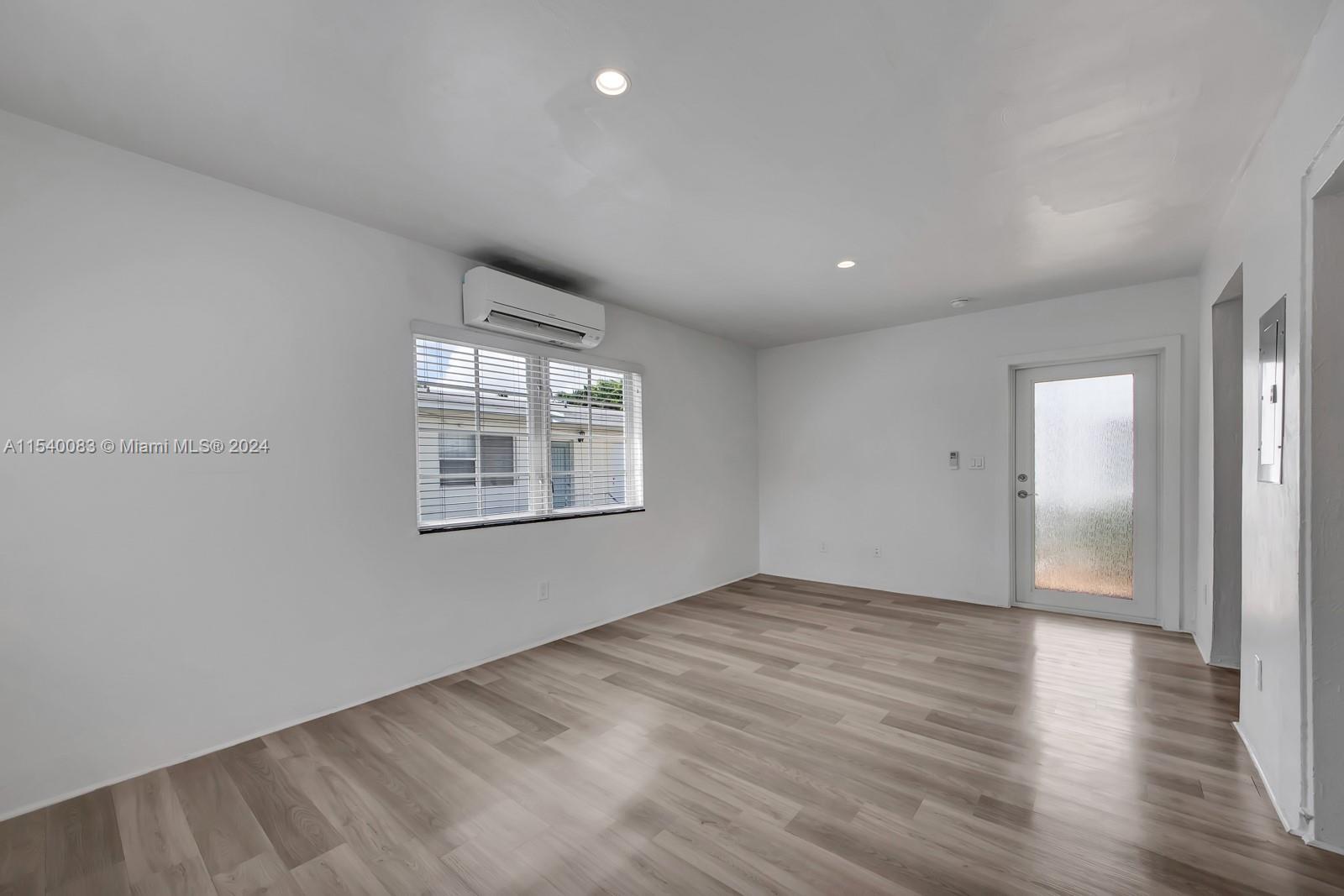 Palm Grove Miami, FL 33138 - Photo 3 of 13 wooden floor in an empty room with a window