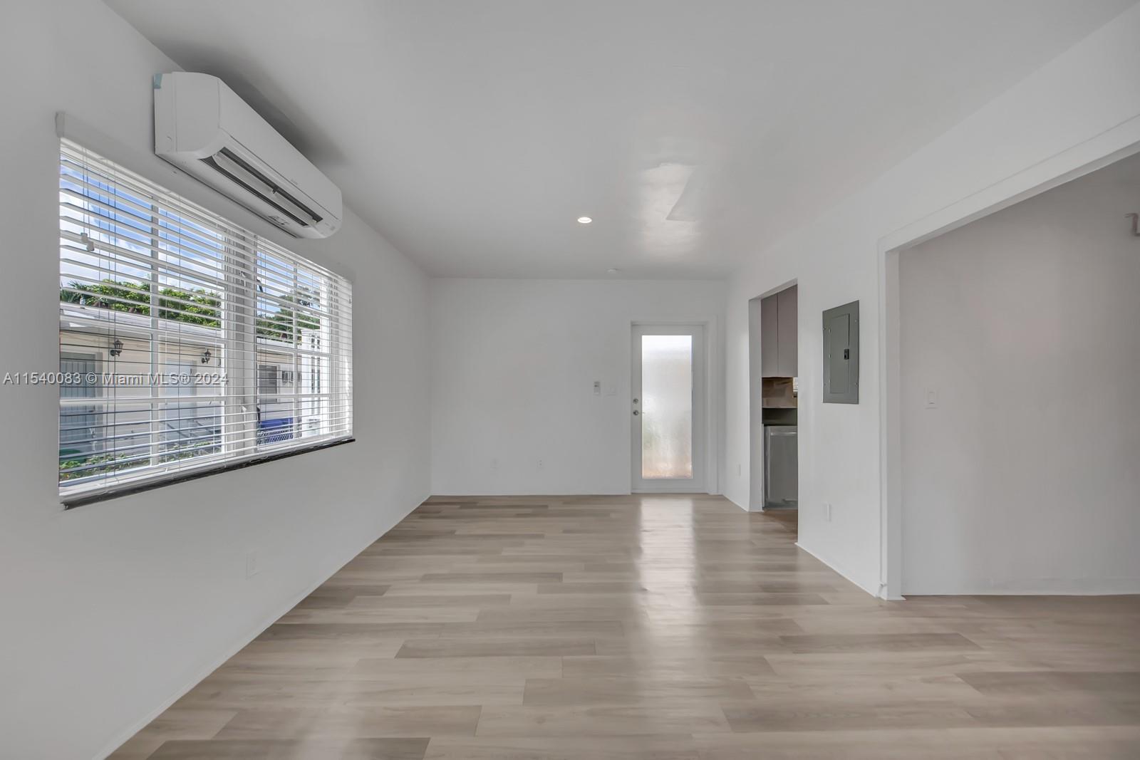 Palm Grove Miami, FL 33138 - Photo 4 of 13 a view of an empty room with wooden floor and a window