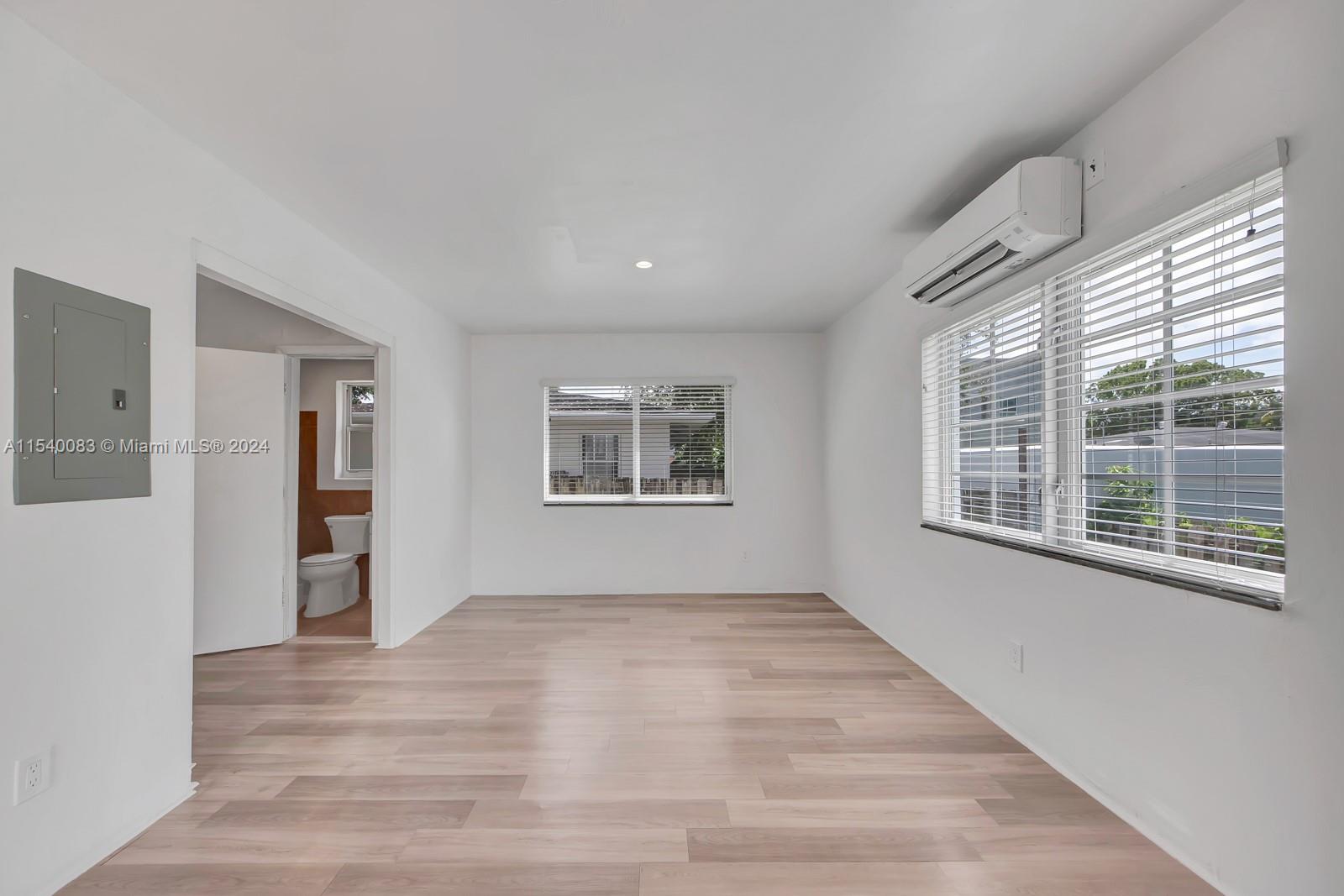 Palm Grove Miami, FL 33138 - Photo 5 of 13 a view of an empty room with wooden floor and a window