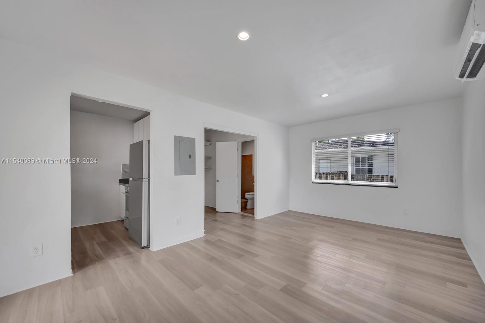 Palm Grove Miami, FL 33138 - Photo 6 of 13 a view of an empty room with wooden floor and a window