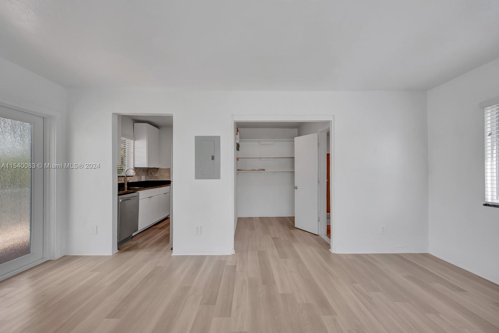 Palm Grove Miami, FL 33138 - Photo 7 of 13 a view of a kitchen with a refrigerator a stove top oven and cabinets