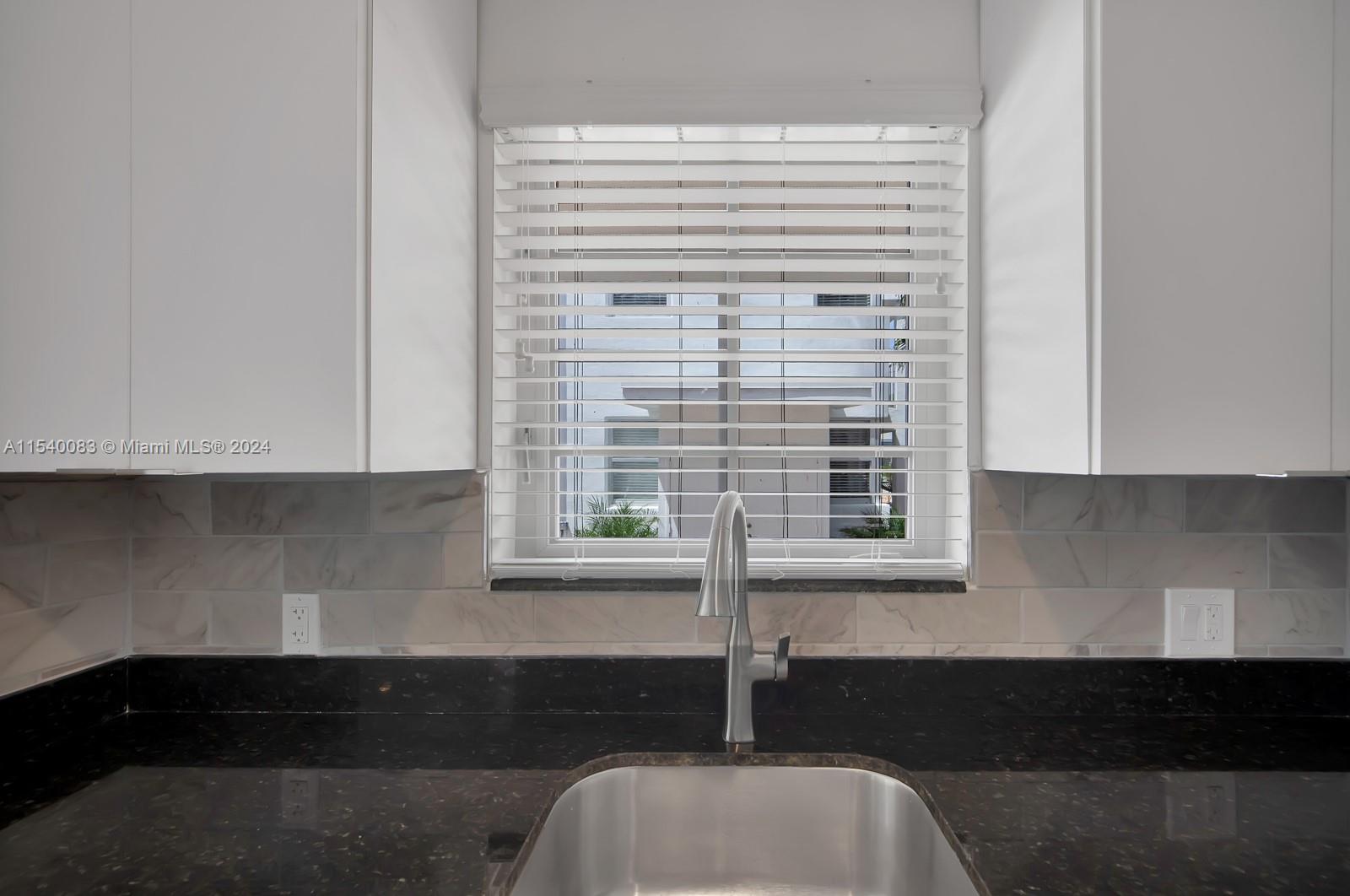 Palm Grove Miami, FL 33138 - Photo 10 of 13 a kitchen with a sink and cabinets