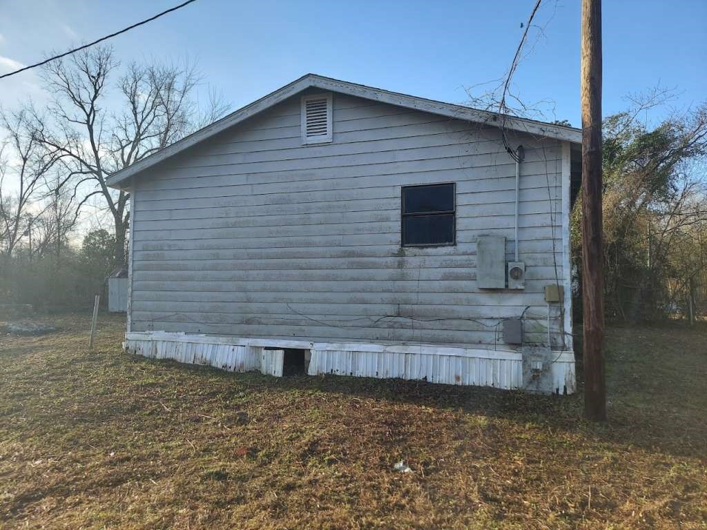 105 Lodge Street Ore City, TX 75683 - Photo 2 of 9 a backyard of a house