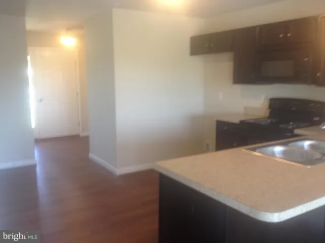 a view of cabinets and wooden floor