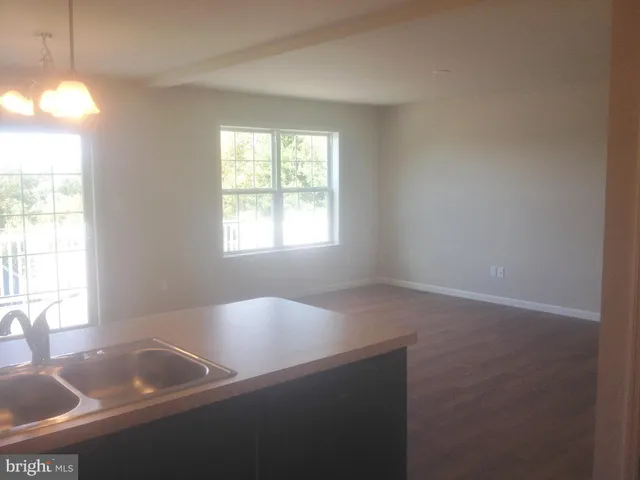 a bathroom with a sink and a window