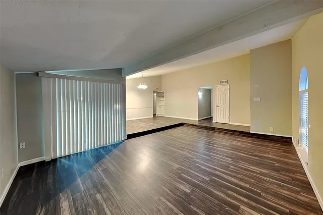 a view of a livingroom with wooden floor