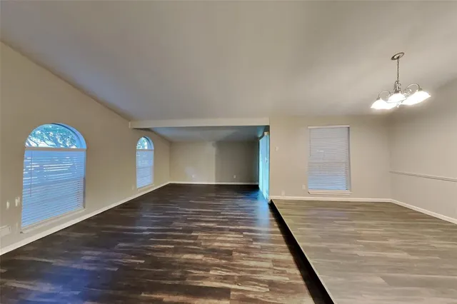 a view of a livingroom with wooden floor