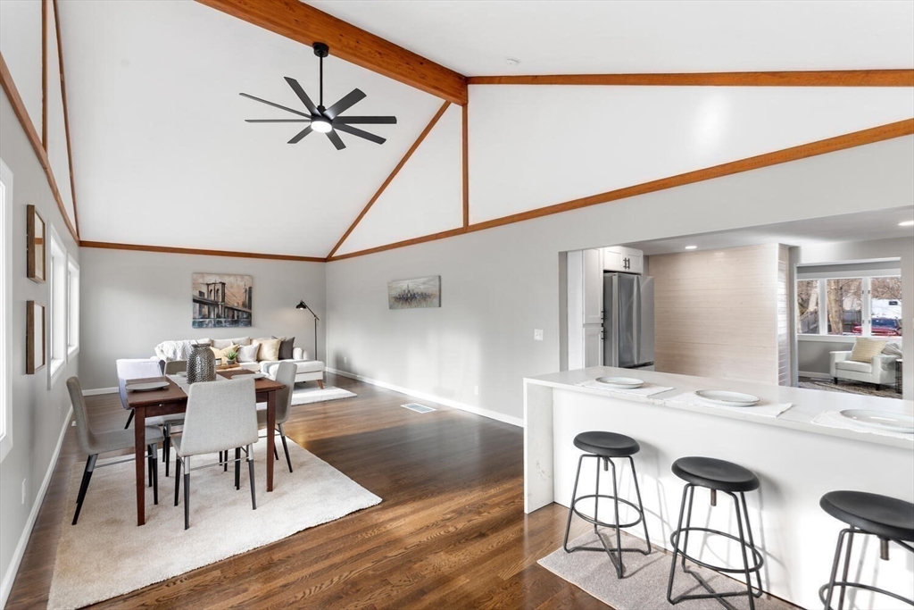 49 Butler Avenue Stoneham, MA 02180 - Photo 14 of 36 a view of a dining room with furniture and wooden floor