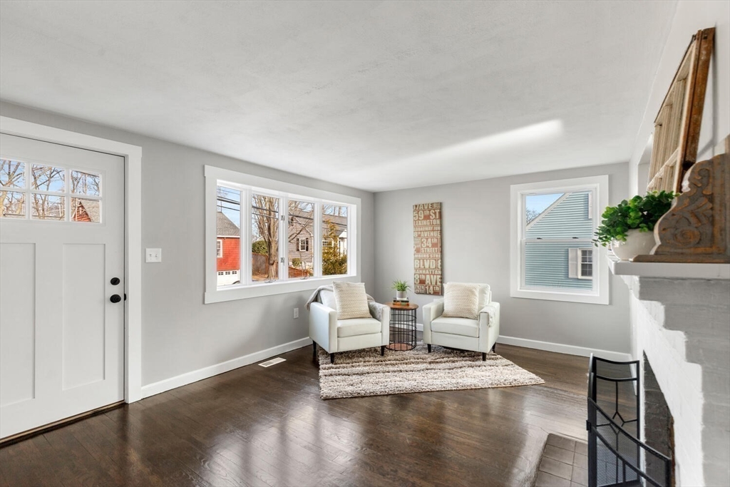49 Butler Avenue Stoneham, MA 02180 - Photo 20 of 36 a living room with furniture window and wooden floor