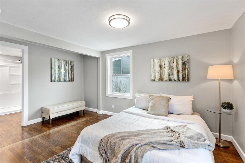 49 Butler Avenue Stoneham, MA 02180 - Photo 23 of 36 a bedroom with a bed and a couch