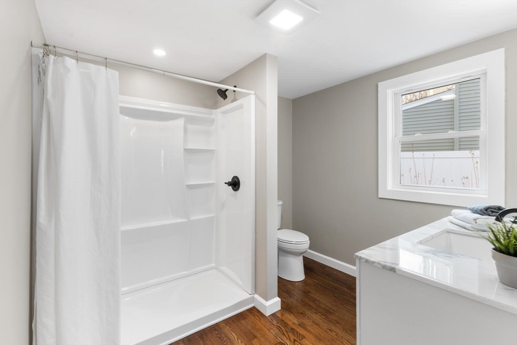 49 Butler Avenue Stoneham, MA 02180 - Photo 24 of 36 a bathroom with a sink a toilet and shower