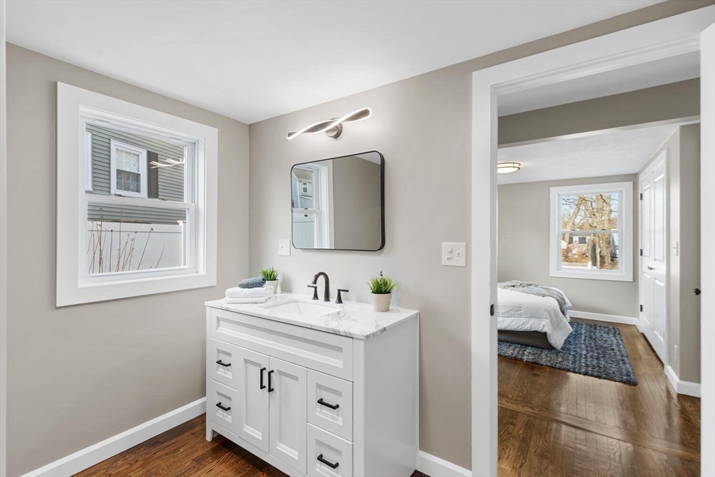 49 Butler Avenue Stoneham, MA 02180 - Photo 25 of 36 a en suite bathroom with 2 sink toilet and a mirror