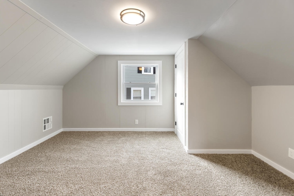 49 Butler Avenue Stoneham, MA 02180 - Photo 27 of 36 an empty room with windows