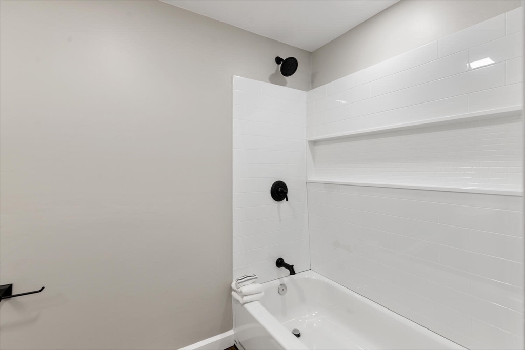 49 Butler Avenue Stoneham, MA 02180 - Photo 28 of 36 a bathroom with a tub