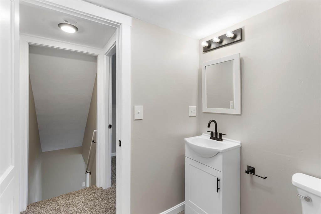 49 Butler Avenue Stoneham, MA 02180 - Photo 30 of 36 a bathroom with a sink and a mirror