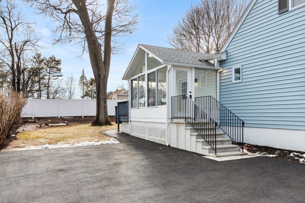 49 Butler Avenue Stoneham, MA 02180 - Photo 5 of 36 a view of a house with snow on the road