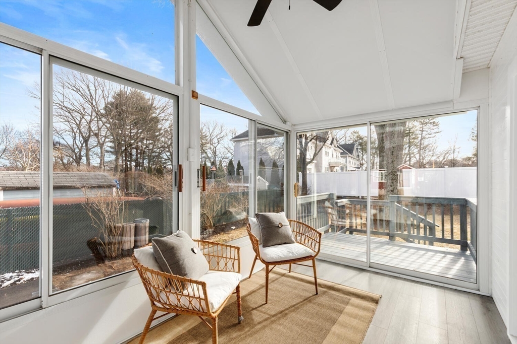 49 Butler Avenue Stoneham, MA 02180 - Photo 6 of 36 a living room with furniture and a floor to ceiling window