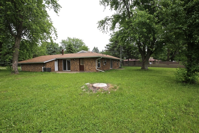 404 Hillside Road Joliet, IL 60433 - Photo 10 of 10 a front view of a house with garden