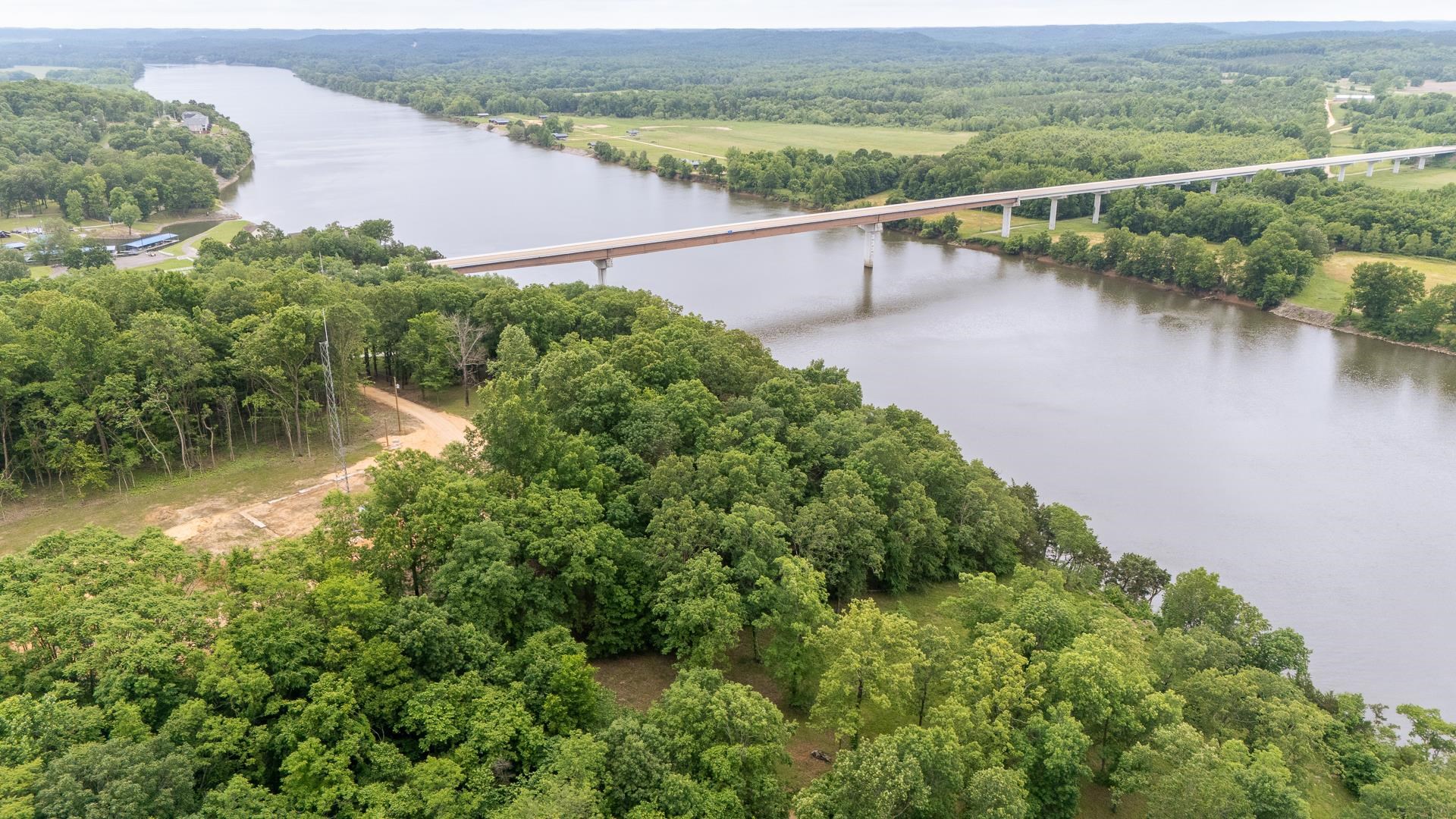 175 Bridgeview Lane Bath Springs, TN 38311 - Photo 11 of 30 an aerial view of a house with a yard and lake view