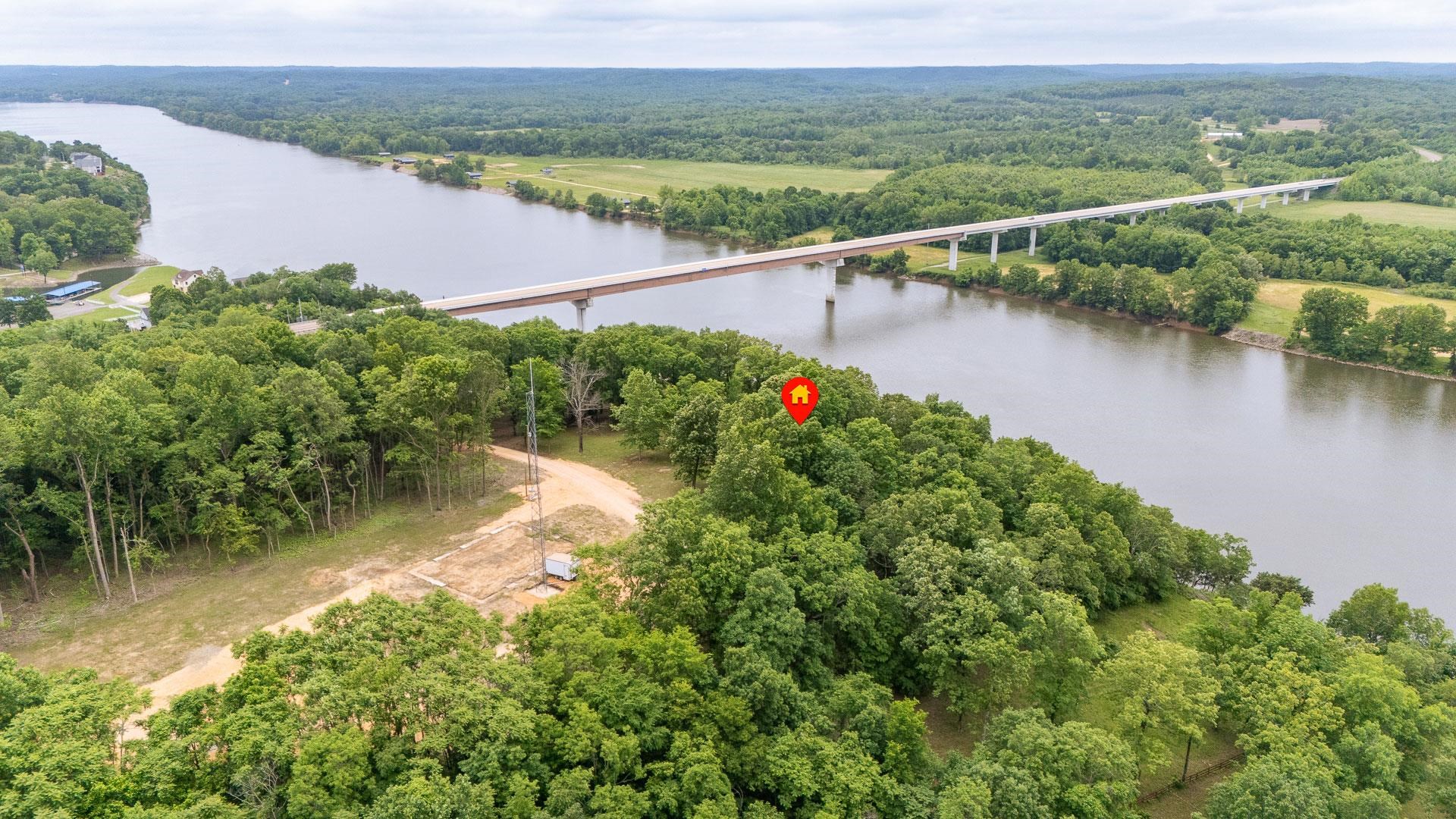 175 Bridgeview Lane Bath Springs, TN 38311 - Photo 29 of 30 a view of a lake with a city view