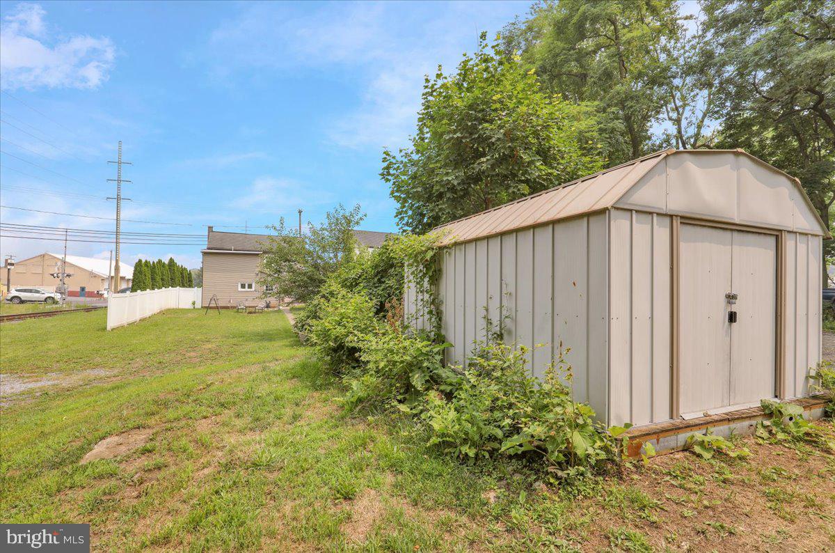 724 Rohrerstown Road Lancaster, PA 17603 - Photo 29 of 31 Charming shed nestled in lush greenery.