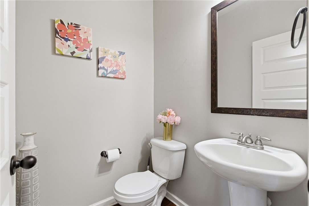 138 Buckland Drive Anderson, SC 29621 - Photo 20 of 49 This clean and bright powder room features a pedestal sink and modern fixtures, creating a functional space.