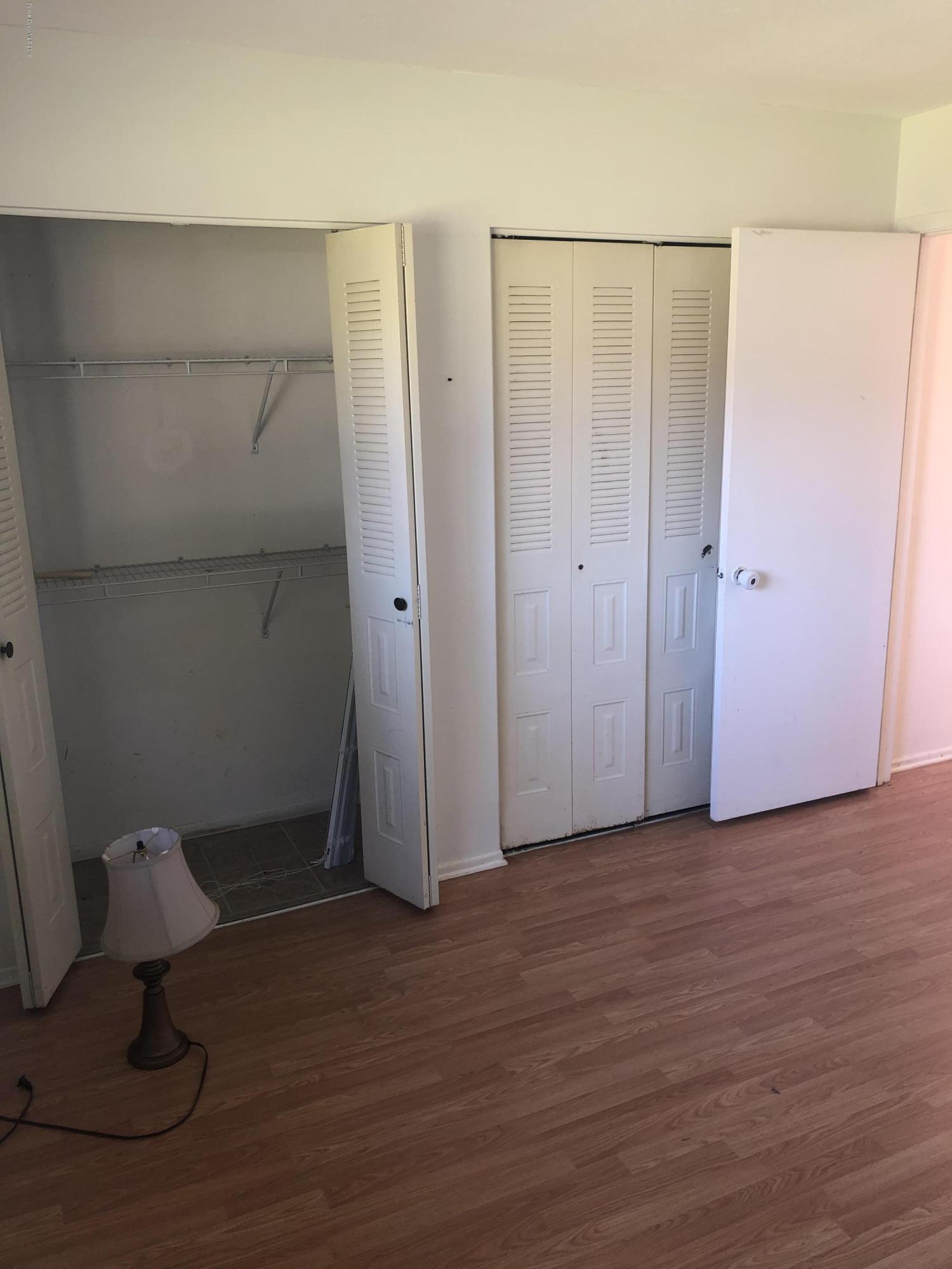 232 Abalone Road Northwest Palm Bay, FL 32907 - Photo 12 of 18 a view of a room with wooden floor