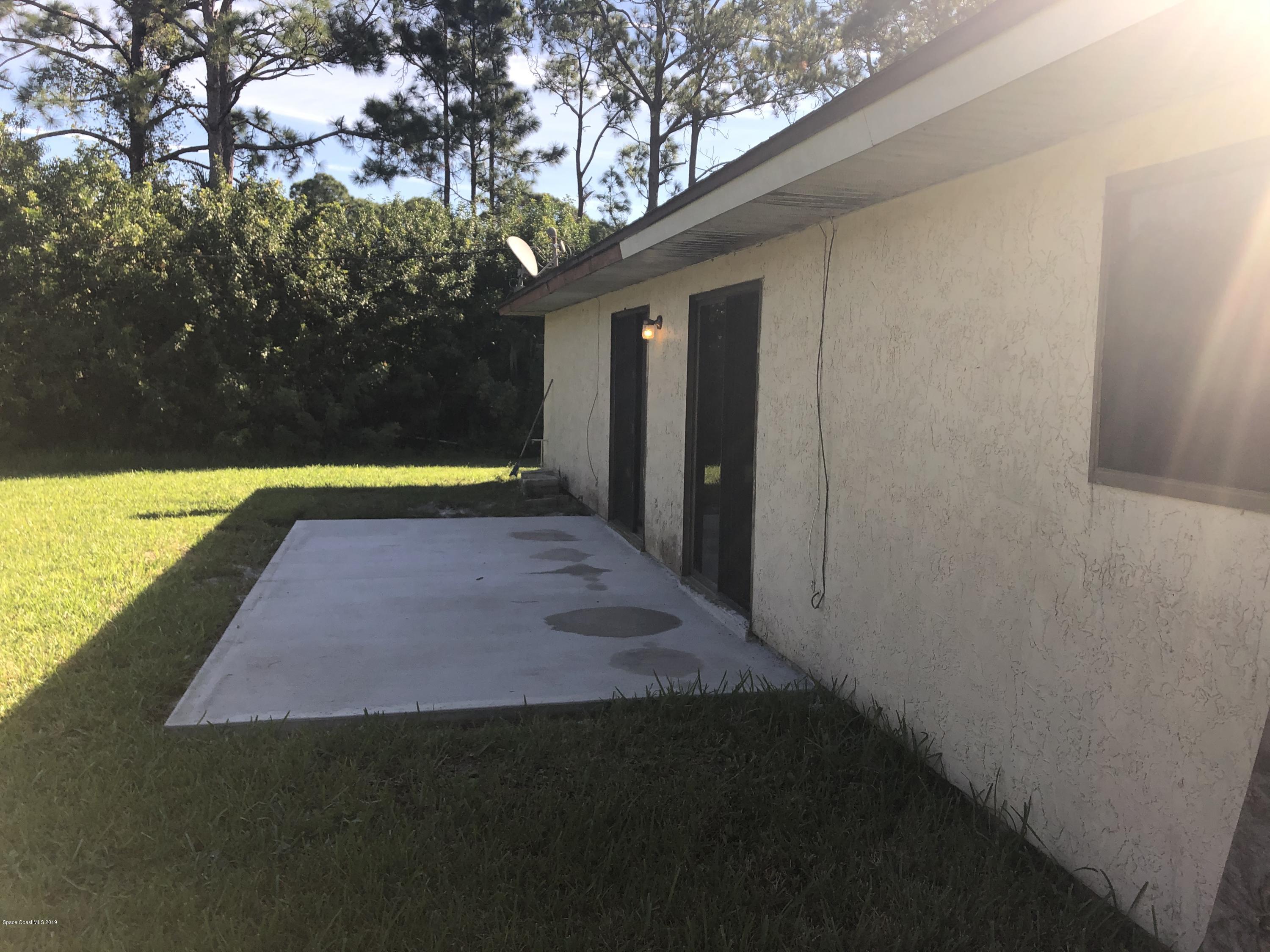 232 Abalone Road Northwest Palm Bay, FL 32907 - Photo 16 of 18 a view of swimming pool with seating space