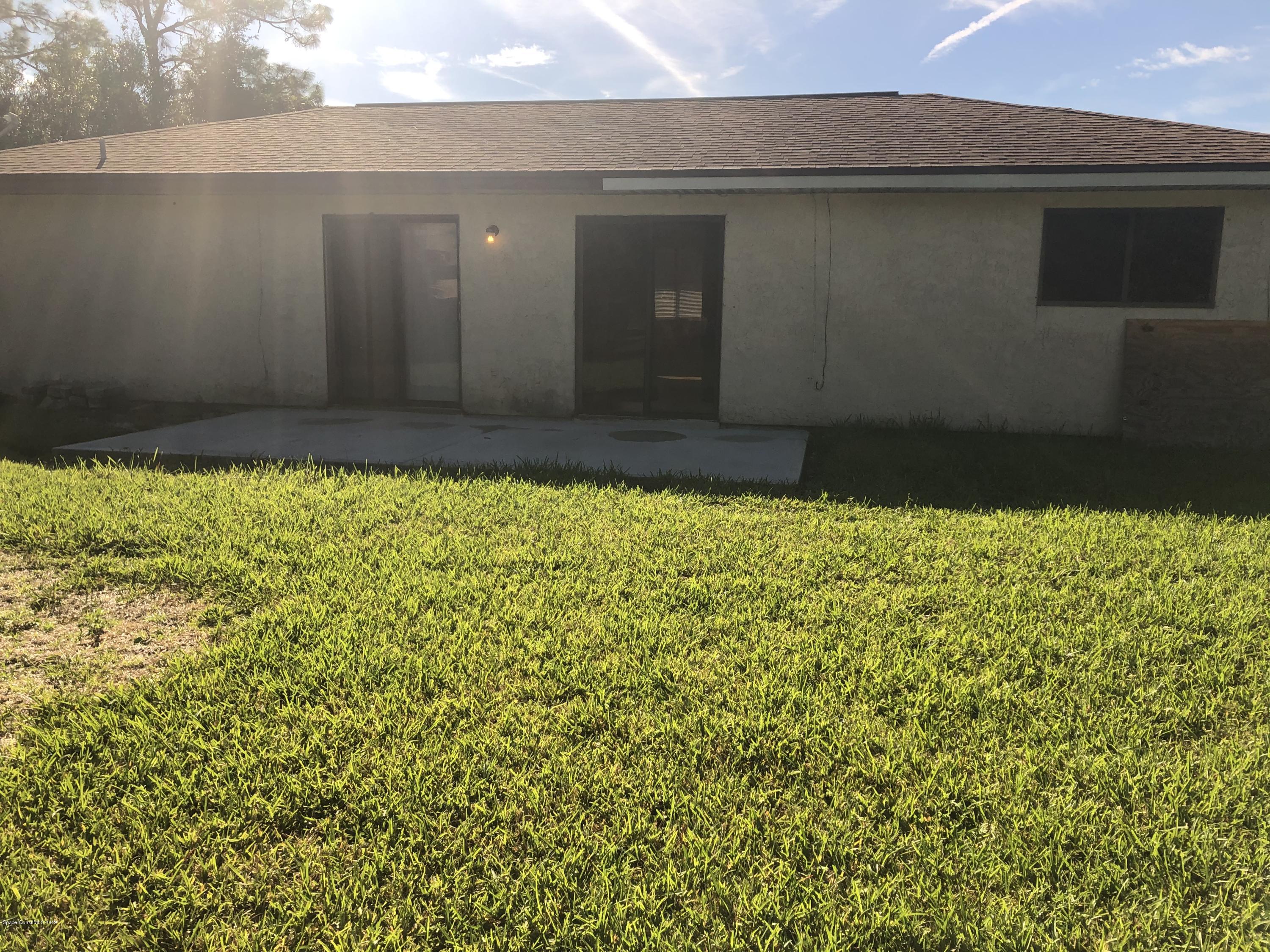 232 Abalone Road Northwest Palm Bay, FL 32907 - Photo 18 of 18 a view of bunch of flowers