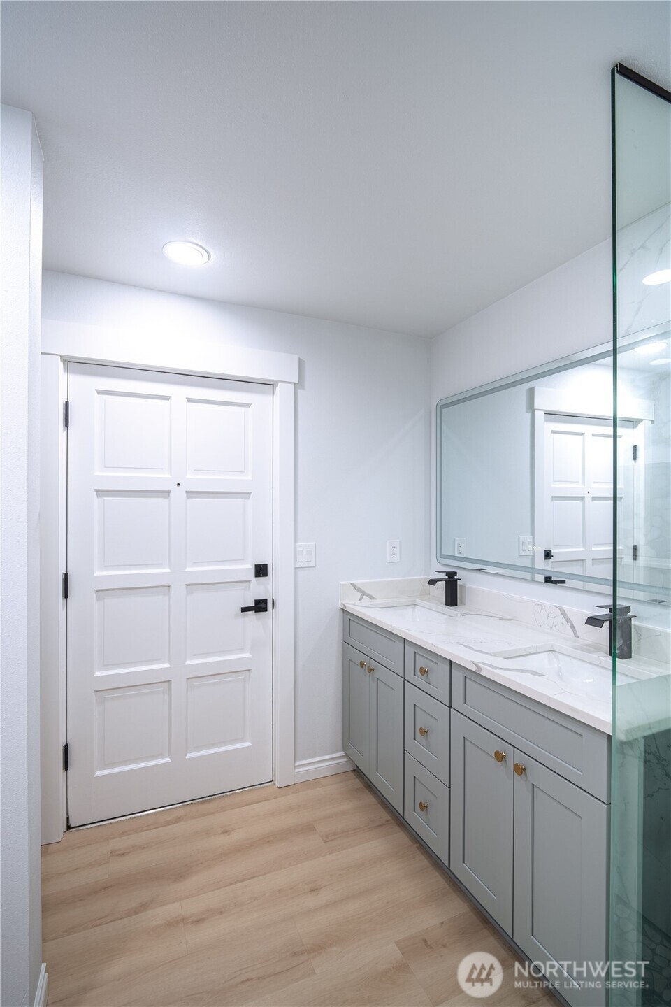 2802 Garden Court, Unit A Steilacoom, WA 98388 - Photo 16 of 29 a bathroom with a double vanity sink and mirror